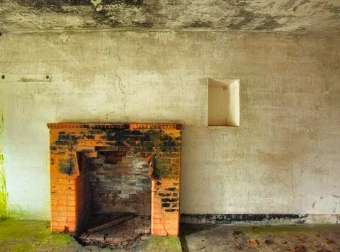 Decaying interior wall with fireplace Stock Photos