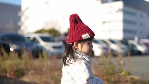 In December 2024, a 3-year-old Japanese girl spends a winter evening in a 스톡 동영상 296978852
