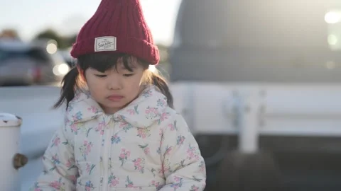 In December 2024, a 3-year-old Japanese girl spends a winter evening in a Stock Footage 297013737