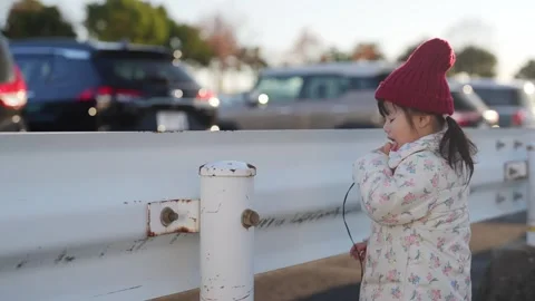 In December 2024, a 3-year-old Japanese girl spends a winter evening in a Stock Footage 297015087