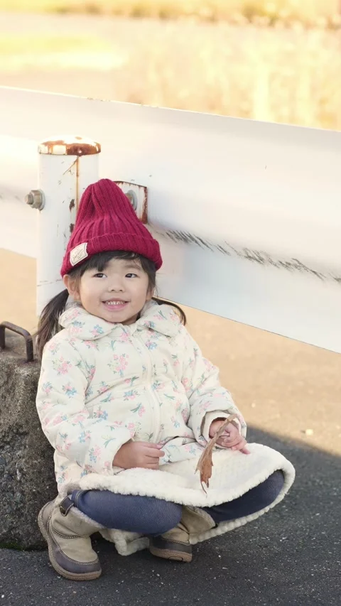 In December 2024, a 3-year-old Japanese girl spends a winter evening surrounded Stock Footage 297019120