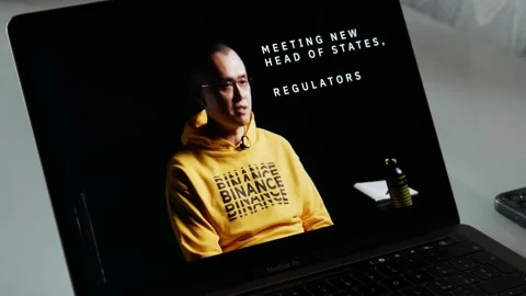 DECEMBER 27, 2022: Binance CEO, CZ Changpeng Zhao, Interview, Watching the Video Stock Footage 235817588