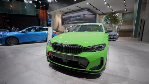 December 28, 2022. Munich. Germany. Green BMW 3 Series with M Performance parts Stock Footage 328368265