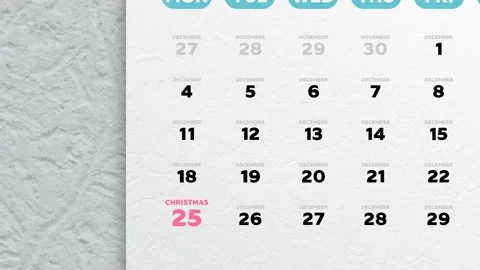 A December page of the wall calendar 2022 and the camera moves to Christmas date Stock Footage 252579437