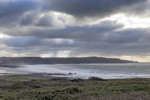 December storm clouds at Widemouth Bay Cornwall Foto stock