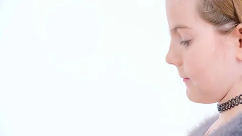 Deciding to try out a small red apple Stock Footage 83724982