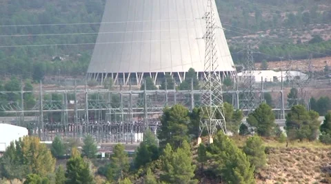 From deciduous trees to nuclear cooling tower, tilt up Stock Footage 49953771