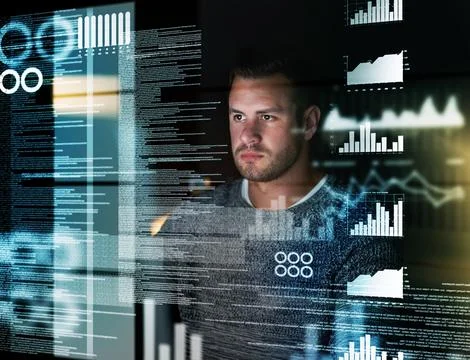 Deciphering the metadata. Shot of a focussed computer programmer working at his 写真素材