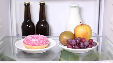 Decision for candy instead of fruit Stock Footage 135381366