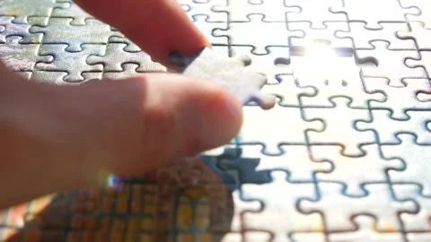 Decision making concept. Finding a solution. Hand matching jigsaw pieces. Jigsaw Stock Footage 133516873