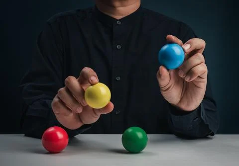 Decision making concept with hands choosing colorful balls. Multiple choice.. Stock Photos