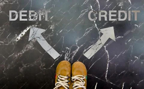 Decision Time Choosing Between Credit And Debit Stock Photos