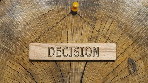 Decision word. Written on wooden rectangular frame surface. Background log su Stock Photos