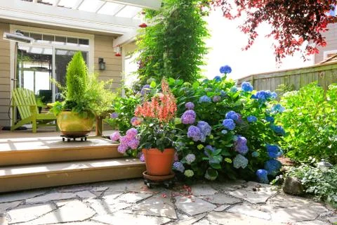 Deck with beautiful flowers in pots Stock Photos