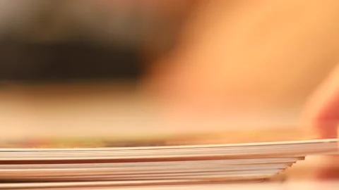 A deck of cards close-up on the side and to the top lay down another card Stock Footage 134469115