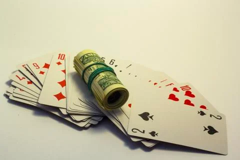 A deck of cards with dollars Stock Photos