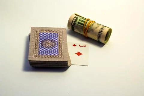 A deck of cards with dollars Stock Photos