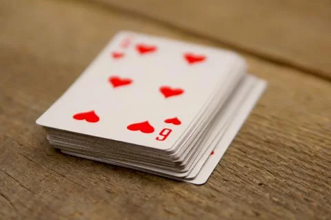 Deck of cards on old vintage table focus Stockfoto's