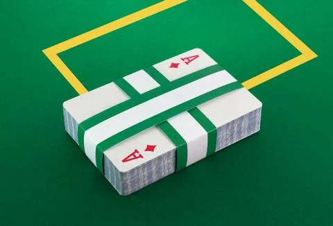 Deck of cards on poker table Stock Photos