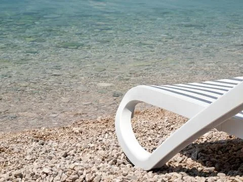 Deck chair on beach 库存照片