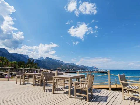 Deck chairs and table overlooking Mediterranean Sea in Kemer, Turkey Stock-Fotos
