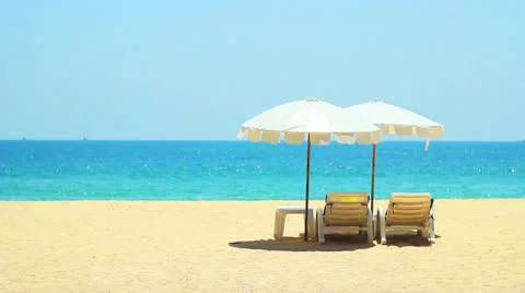 Deck chairs on the beach Stock Footage 24650801