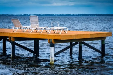 Deck with chairs over a river Stock Photos