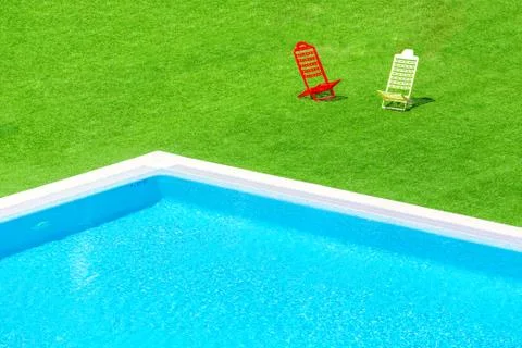 Deck chairs overlooking infinity swimming pool Stock Photos