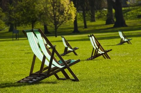 Deck chairs in a park 写真素材