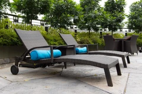 Deck chairs at the pool Stock Photos