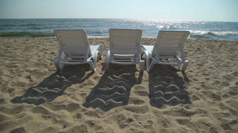 Deck chairs on the tropical beach Stock Footage 67807586