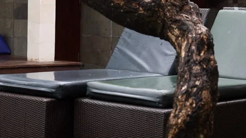 Deck chairs under rain. Yellow leaf falling to the deck chair. Stock Footage 158079005