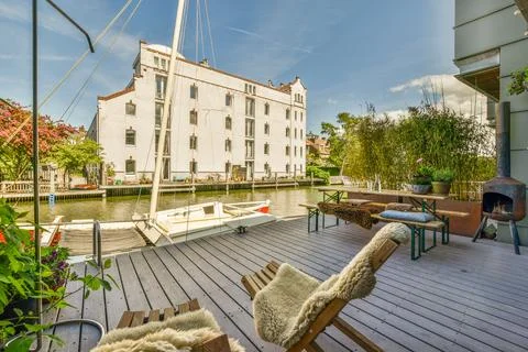 A deck with a dock and a boat in a Stock Photos