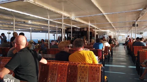 Deck of the ferry. Tourists sit on deck during a sea trip. Stock Footage 126691743