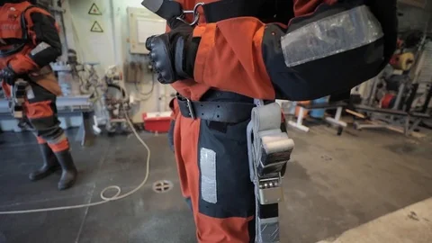 Deck hands secure Super Lynx and practice escorting a passenger - 2018 Stock Footage 106143018