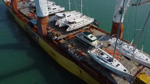 Deck of a large international cargo ship, many sailing boats on board Stock Footage 170189663