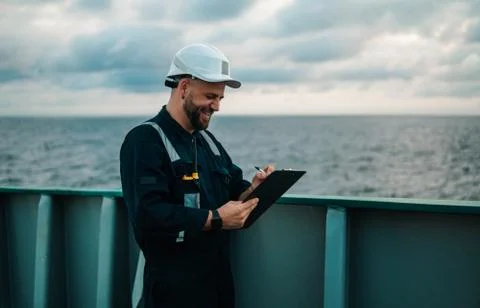 Deck Officer on deck of offshore vessel or ship , wearing PPE personal Stock Photos