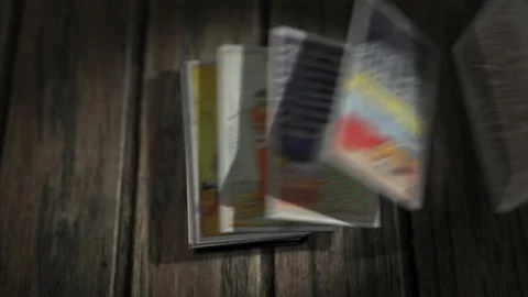 Deck of old tarot cards flying off to the side to reveal the Three of Swords Stock Footage 148796277