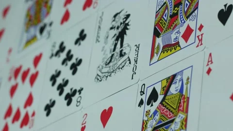 Deck of playing cards is spread out on the table Stock Footage 89544345