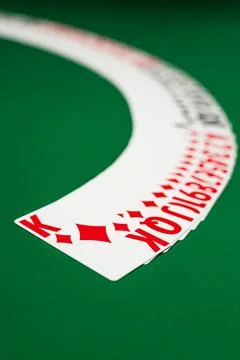 Deck of playing cards spread out on the felt Stock Photos