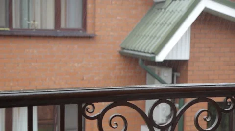 A  deck with railing on a summer afternoon after a rain shower. Видео 51662899