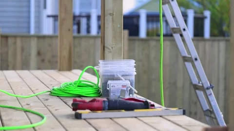 Deck Renovation construction wood work site Pneumatic Brad Nailer, Box of Screws Stock Footage 247271273