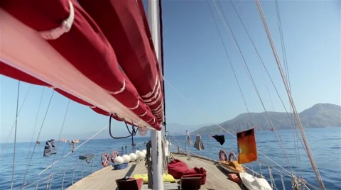 On deck of a sailboat. Mountains in the background. Stock Footage 60640653