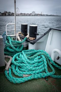 On the deck of a ship lie long ropes for mooring the ship Stock Photos