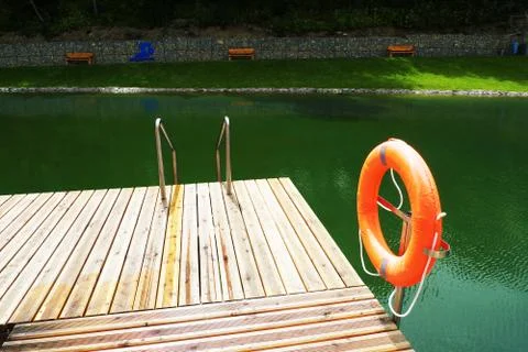 Deck on swimming pool Stock Photos