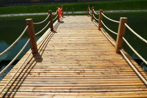 Deck on swimming pool Stock Photos