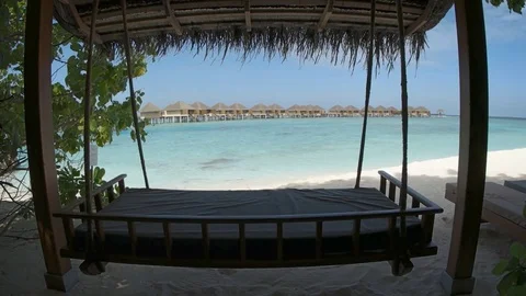 Deck Swing Sways in the Shade at a Resort in the Maldives Stock Footage 75002654