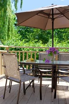 Deck table and chairs Stock Photos