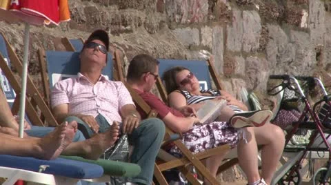 Deckchair Sunbathers Video stock 18010273