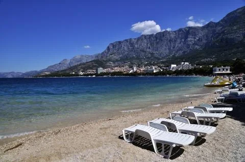 Deckchairs on a beach Stock Photos